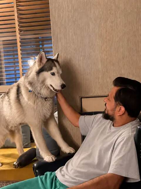 Tushar Kumar sharing a moment with a dog